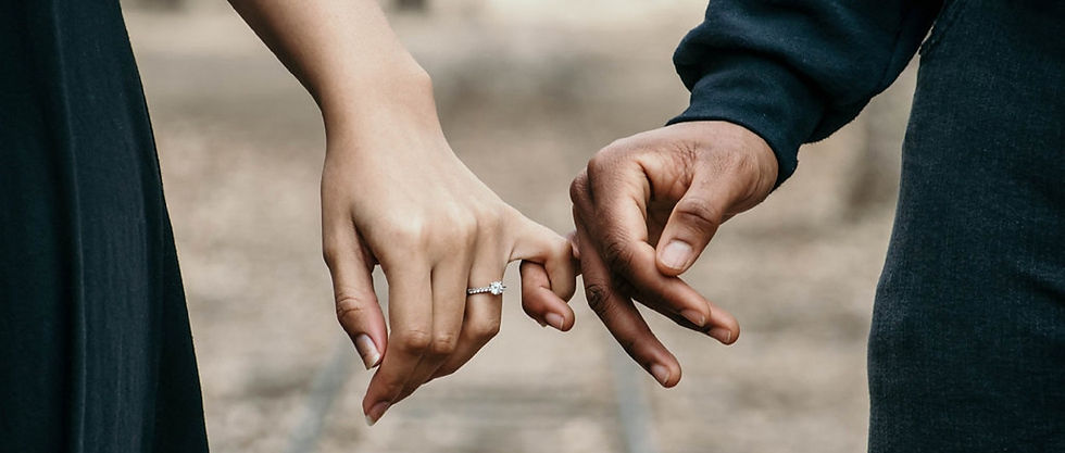 Couple holding hands.