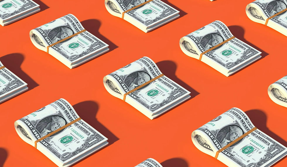 Money stacked in a pattern on a orange background
