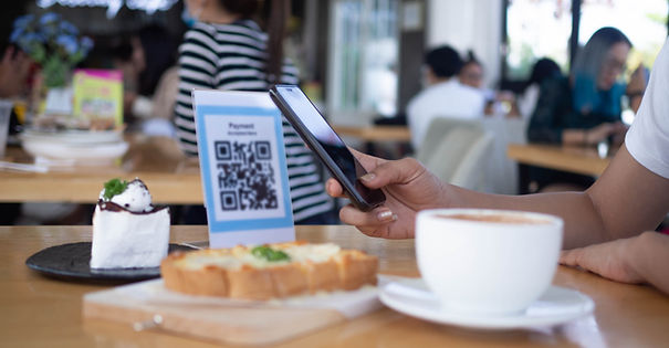 vecteezy_woman-use-smartphone-to-scan-qr-code-to-pay-in-cafe_45807018.jpg