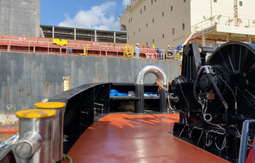 Bisso Towboat ASD Tractor Tug Preparing to Connect With Large Ship