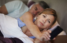 Woman checking the clock on her phone