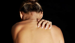 Woman scratching her back