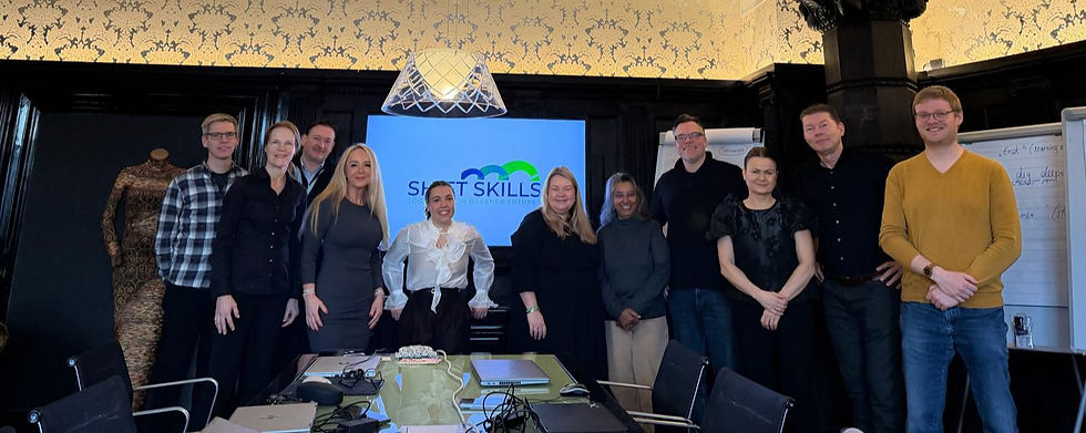 Group photo of the Symbiosis project team in the conference room of the Home Hotel Havnekontoret in Bergen