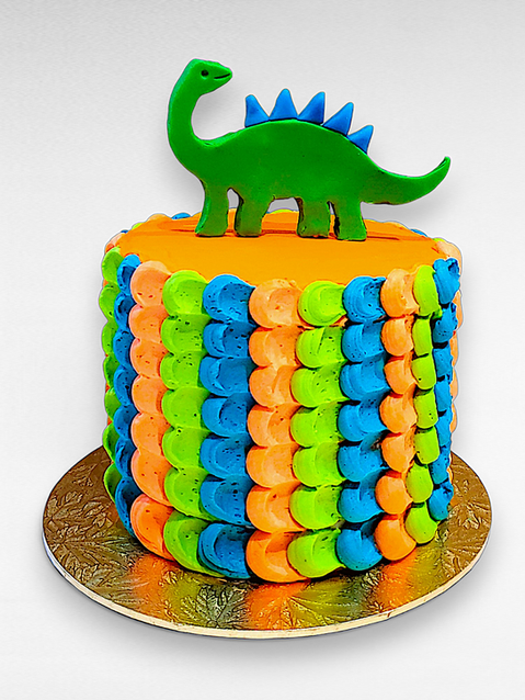 verjaardagstaart met fondant dinosaurus en regenboogkleurige botercrème decoratie – dino cake with colorful frosting pattern