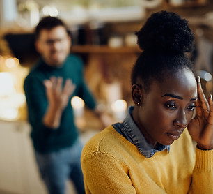 distraught-african-american-woman-having-relationship-difficulties-with-her-boyfriend-home