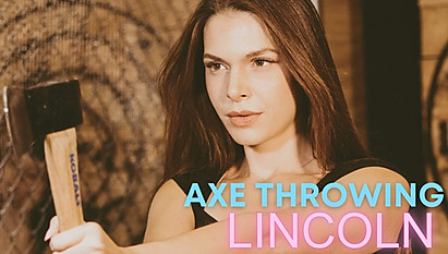 Axe Throwing Lincoln, a woman, throwing an axe
