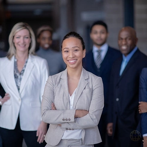 Group of business women and men standing and smiling
