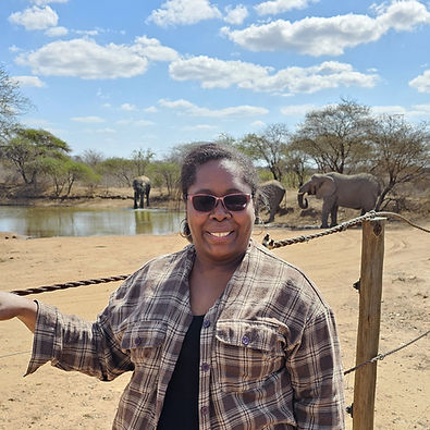 standing at the waterhole while on a safari