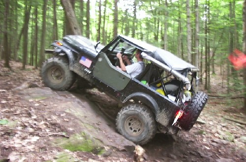 Man driving Jeep on rocky trail