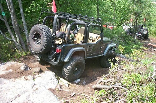 Black Jeep Wrangler off-roading