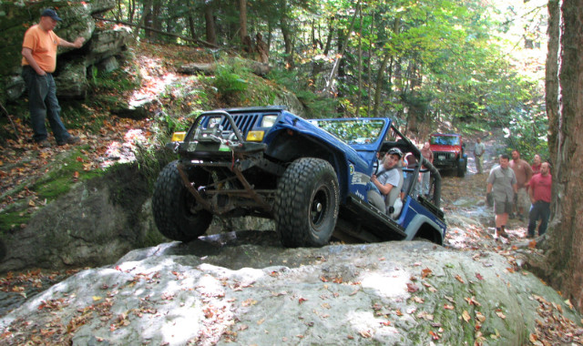 Blue Jeep navigating rocky terrain, Long Island Off Road