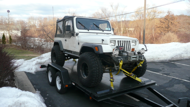 White Jeep Wrangler on trailer