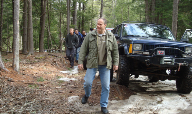 Man walking near off-road vehicle