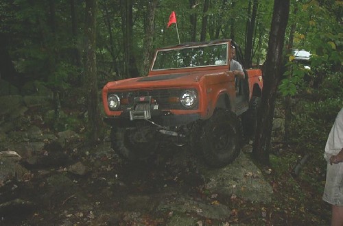 Orange Ford Bronco off-roading
