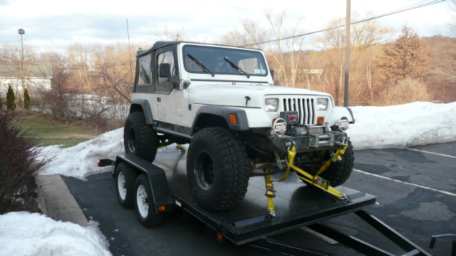 White Jeep Wrangler on trailer