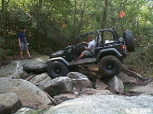 Jeep navigating rocky terrain