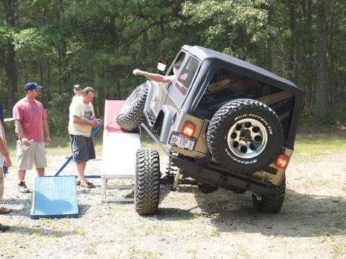 Jeep driving up ramp; off-roading