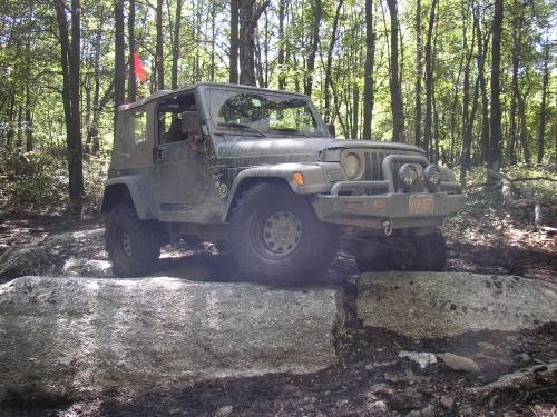 Gray Jeep Wrangler traversing rocks, Long Island Off Road