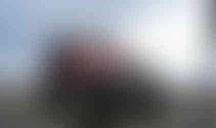 Red Jeep on rocky summit