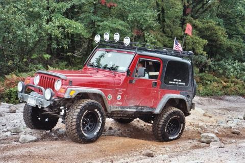 Red Jeep Wrangler off-roading Long Island