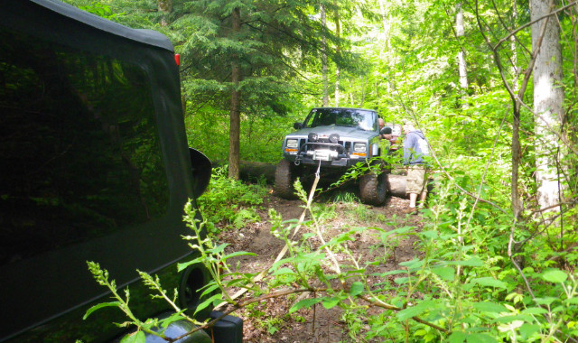 Jeep being winched on trail