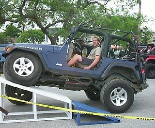 Man in Jeep ascending ramp
