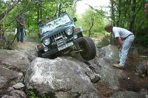 Jeep navigating rocky terrain