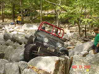 Jeep traversing rocky terrain