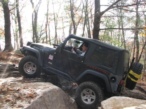 Man driving Jeep on rocky trail