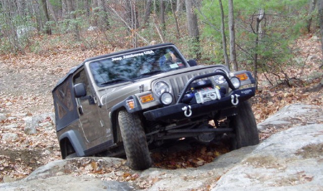 Jeep traversing rocky terrain