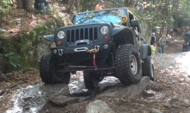 Jeep traversing rocky terrain