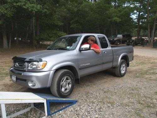 Man in silver pickup truck at ramp