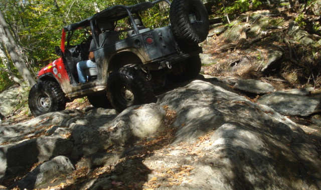 Jeep ascending rocky trail
