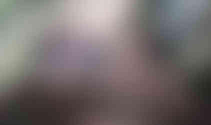 Man watching red Jeep on rocky trail