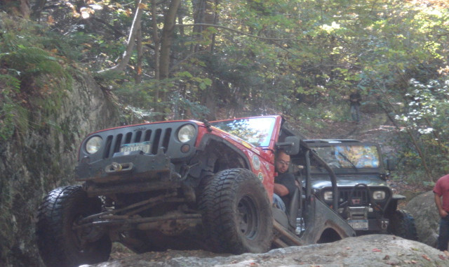 Man driving Jeep on rocky trail