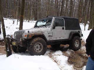 Silver Jeep Wrangler in snowy Long Island Off Road