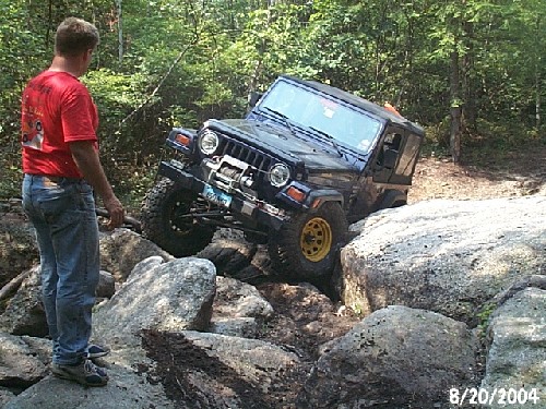 Jeep navigating rocky terrain
