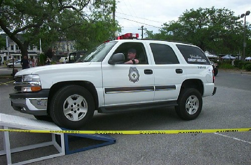 White Chevy Tahoe ambulance on ramp