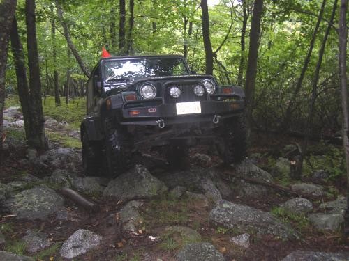 Jeep navigating rocky terrain
