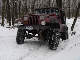 Red Jeep Wrangler in snowy Long Island Off Road