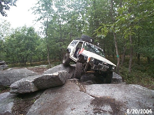 White Jeep Cherokee tackling rocks, Long Island Off Road