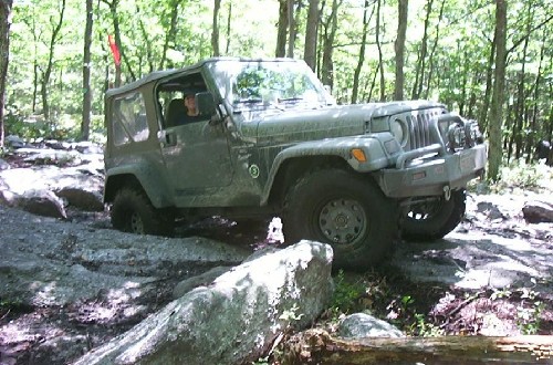 Jeep traversing rocky terrain