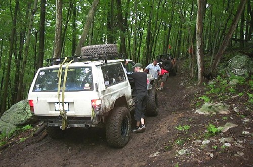 Off-road vehicles on muddy trail