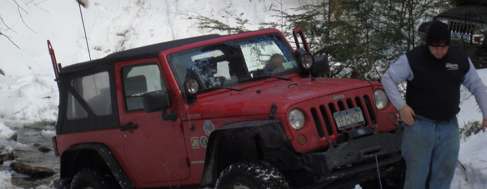 Red Jeep in snowy Long Island Off Road