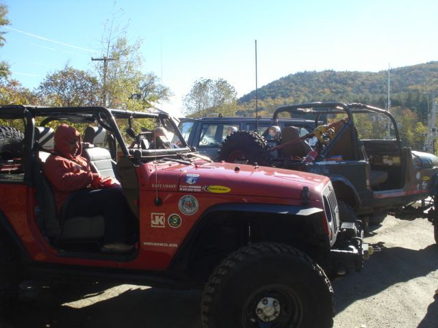 Jeeps parked outdoors, sunny day