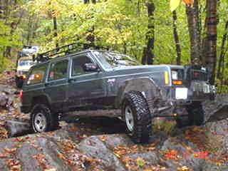 Jeep Cherokee climbing rocks, Long Island Off Road