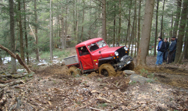 Red truck stuck in mud, Long Island Off Road