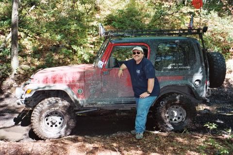 Man standing by muddy Jeep, Carnage Hill Lives Up to It's Name, Long Island Off Road