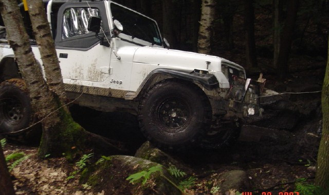 White Jeep navigating rocky terrain, JUL 28 2007