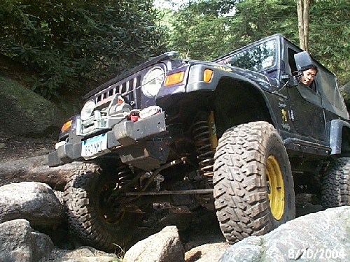 Jeep navigating rocky terrain